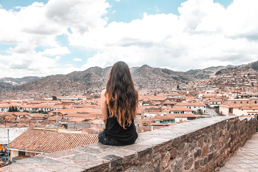 Overlooking Cusco's red rooftops before my day in Machu Picchu and how to get to Machu Picchu on a budget from Cusco
