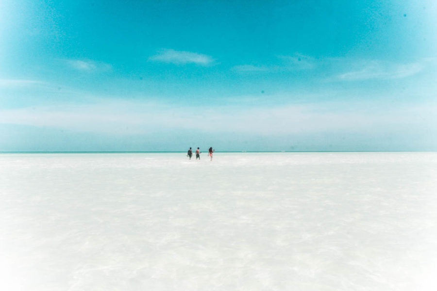 Walking on a salt bank to reach Punta Mosquito, one of the best excursions in Holbox